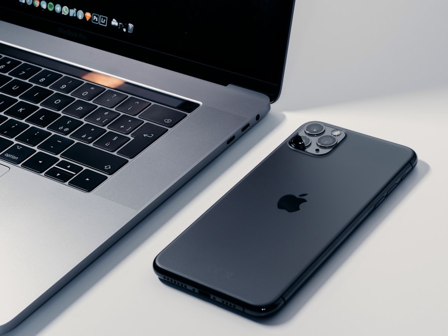 A laptop and a phone resting together on a surface